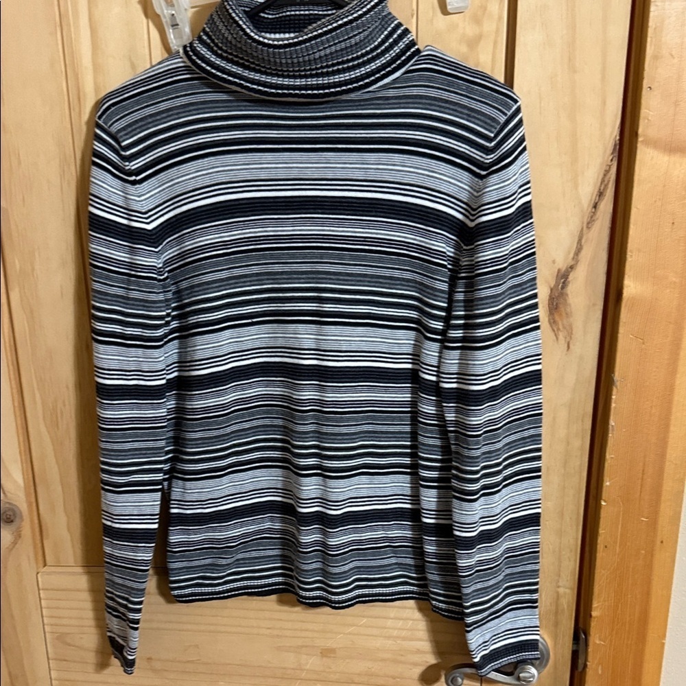 Valerie Steven’s Striped Turtleneck Sweater